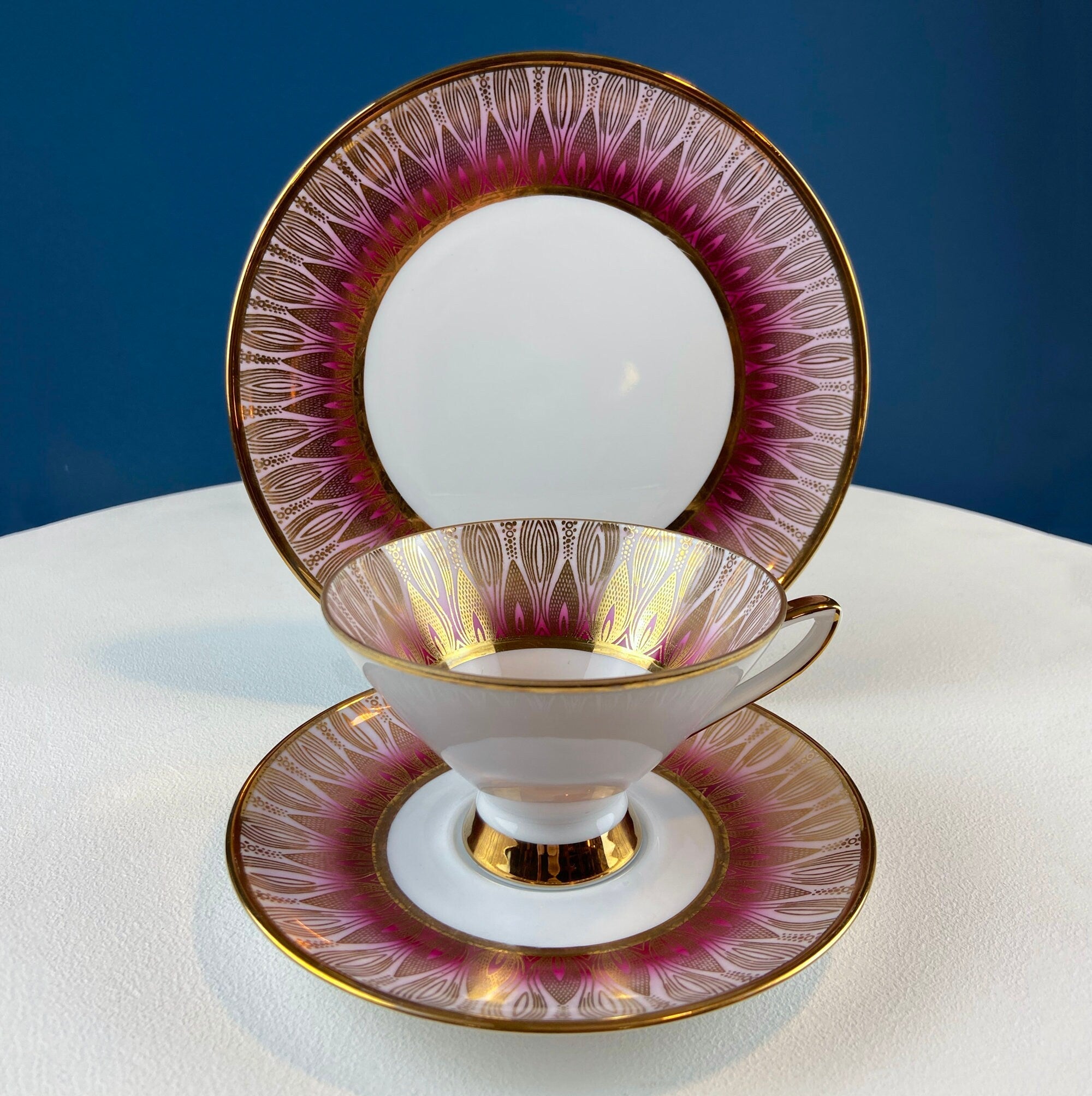 Antique Bavarian Porcelain Tea Trio. Winterling Roslaw. Cup, Saucer, and Dessert Plate in Gold and Pink. Modern Lotus Pattern.