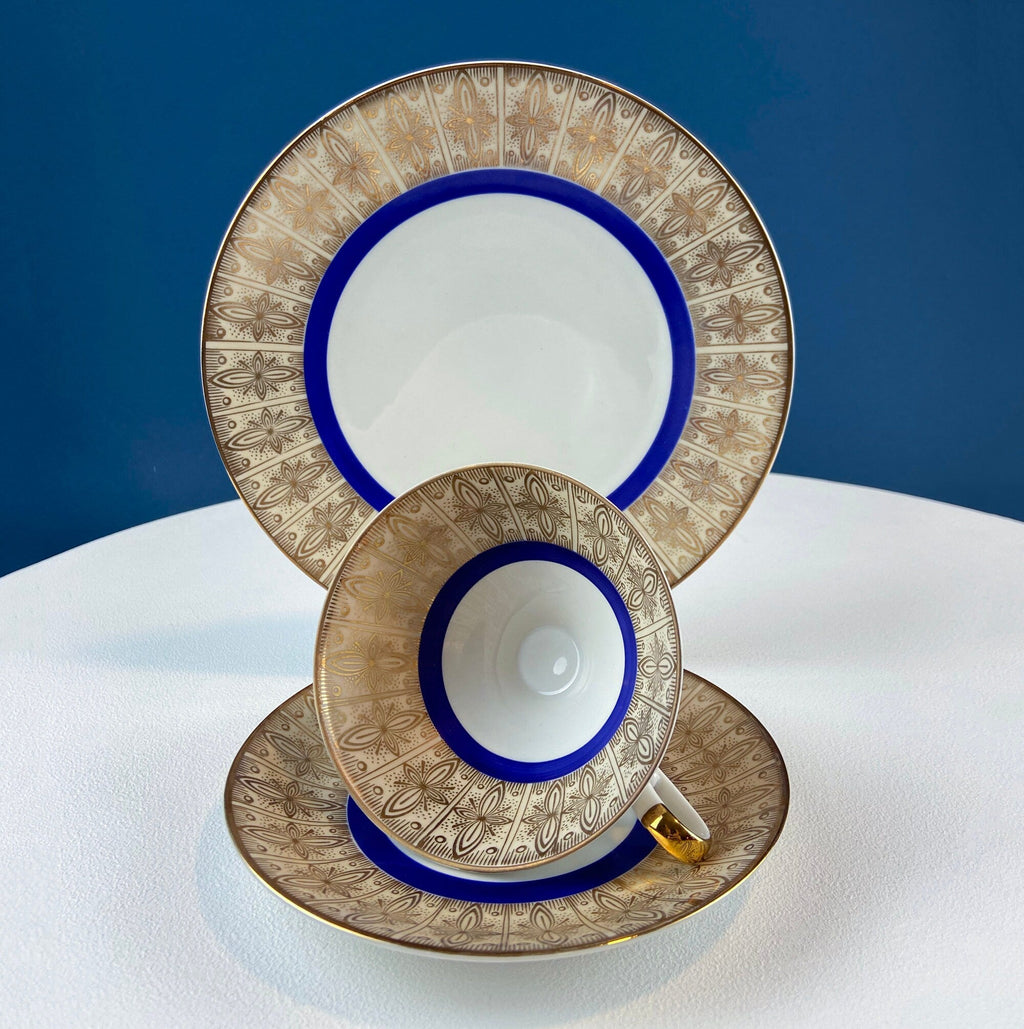 Antique Bavarian Porcelain Tea Trio. Z and Co, Tirschenreuther. Cup, Saucer, and Dessert Plate in Rich Gold and Blue. Modern Floral Pattern.