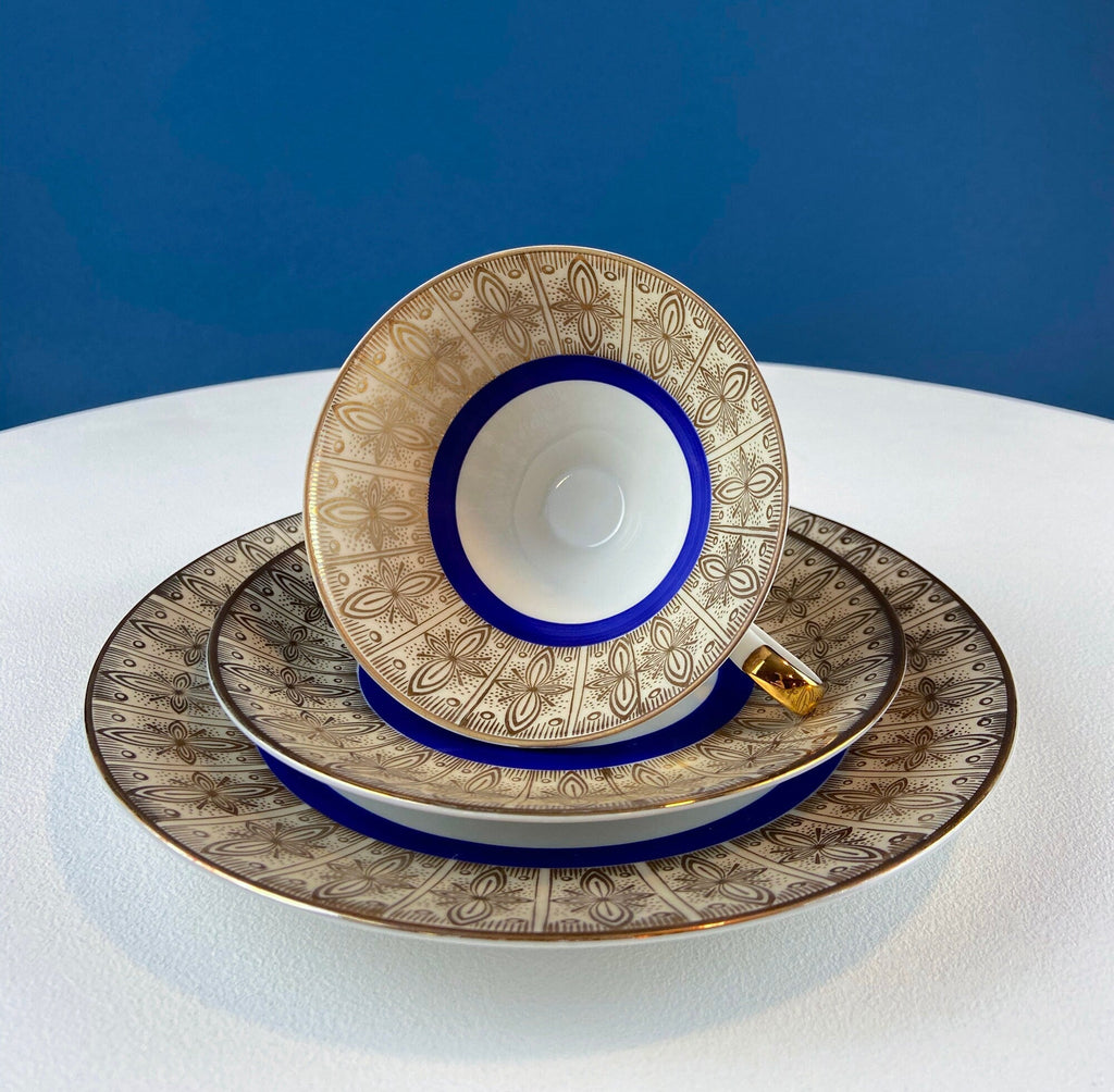 Antique Bavarian Porcelain Tea Trio. Z and Co, Tirschenreuther. Cup, Saucer, and Dessert Plate in Rich Gold and Blue. Modern Floral Pattern.