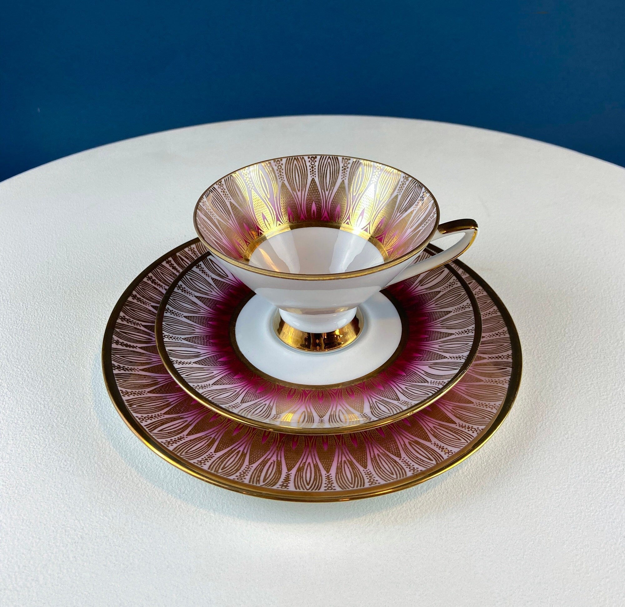 Antique Bavarian Porcelain Tea Trio. Winterling Roslaw. Cup, Saucer, and Dessert Plate in Gold and Pink. Modern Lotus Pattern.