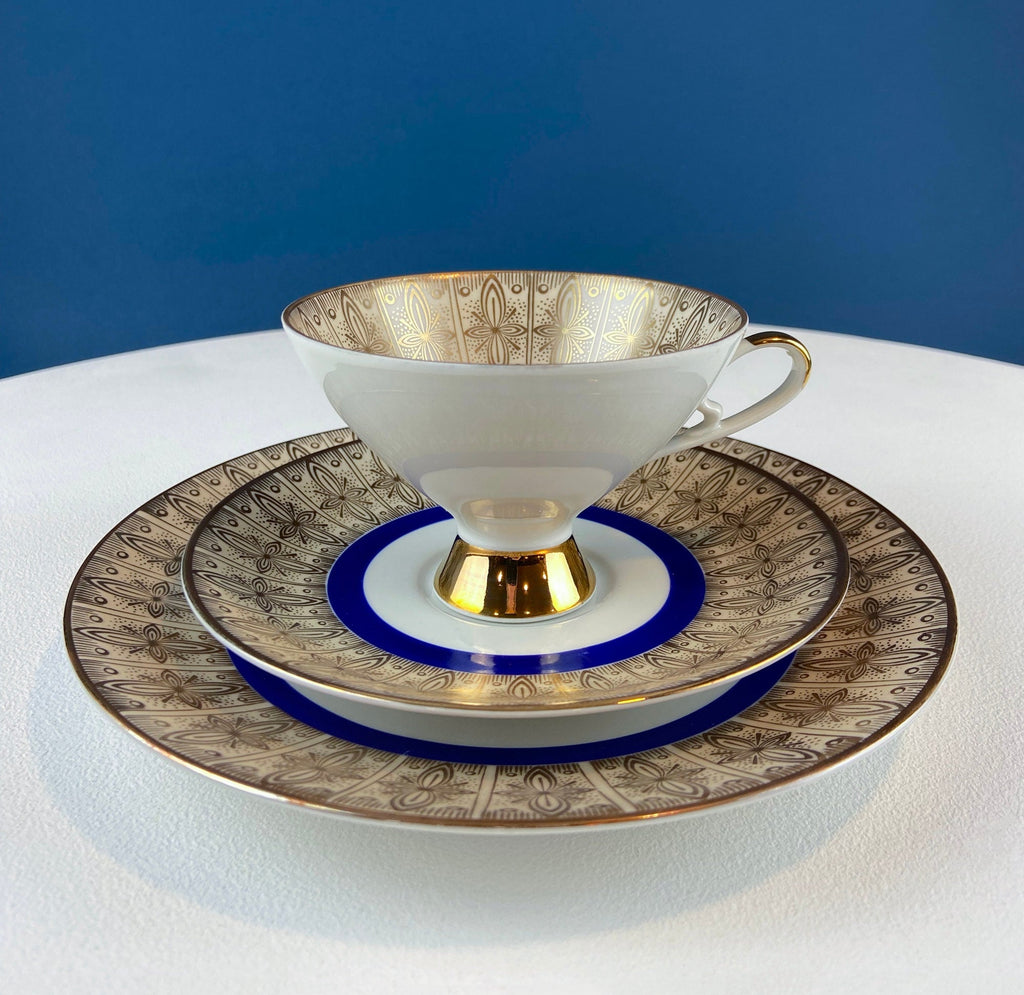 Antique Bavarian Porcelain Tea Trio. Z and Co, Tirschenreuther. Cup, Saucer, and Dessert Plate in Rich Gold and Blue. Modern Floral Pattern.