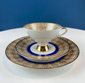 Antique Bavarian Porcelain Tea Trio. Z and Co, Tirschenreuther. Cup, Saucer, and Dessert Plate in Rich Gold and Blue. Modern Floral Pattern.