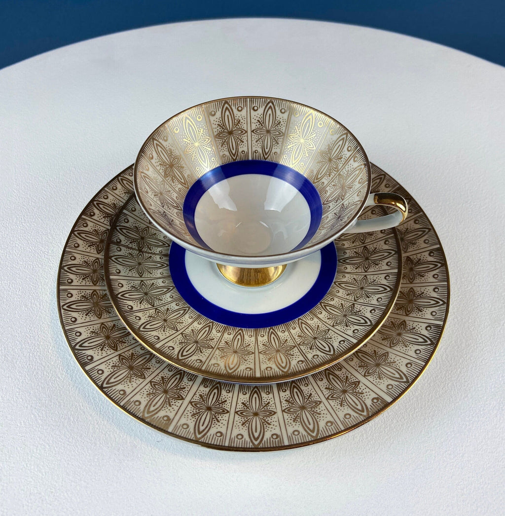 Antique Bavarian Porcelain Tea Trio. Z and Co, Tirschenreuther. Cup, Saucer, and Dessert Plate in Rich Gold and Blue. Modern Floral Pattern.