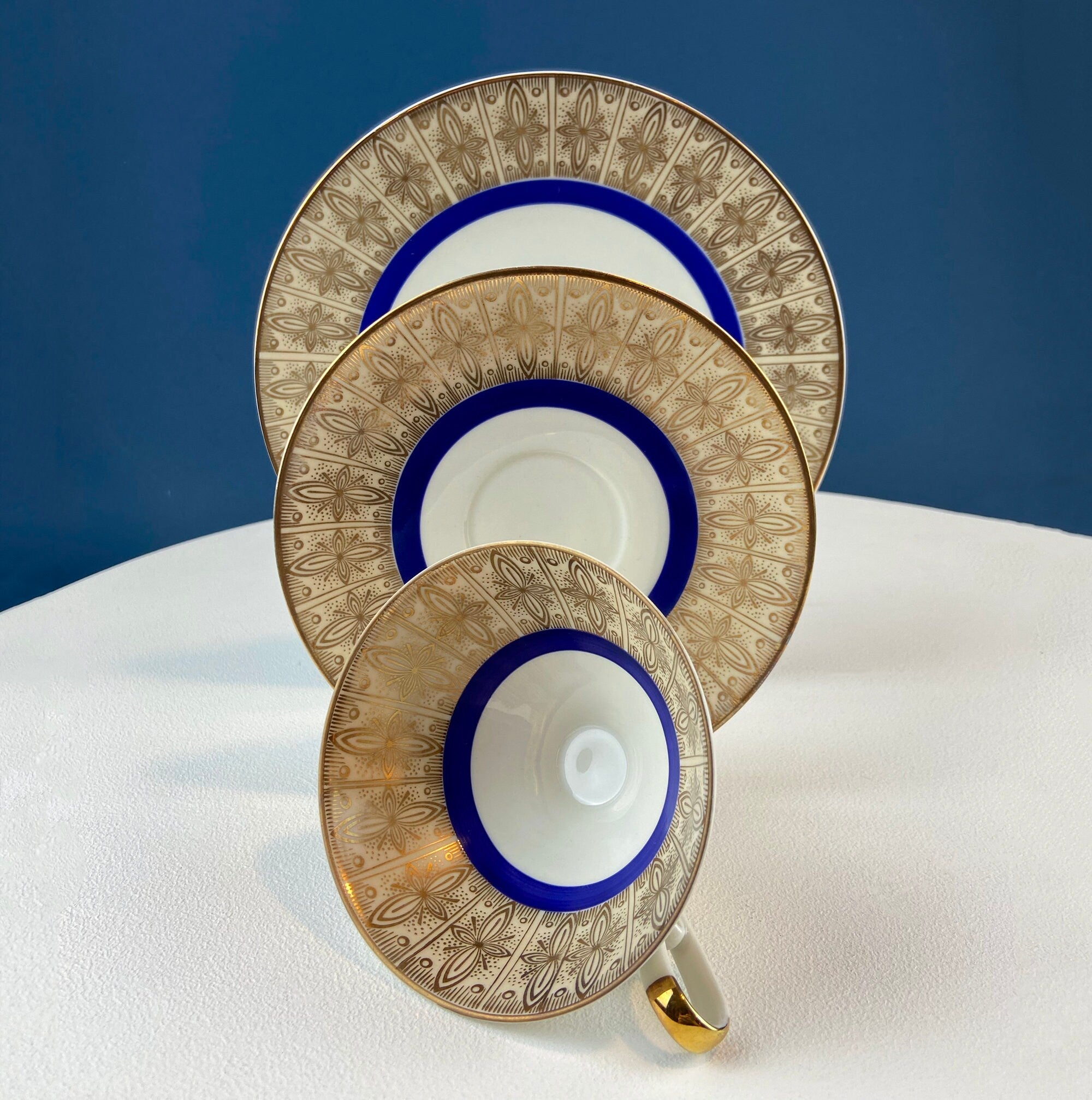 Antique Bavarian Porcelain Tea Trio. Z and Co, Tirschenreuther. Cup, Saucer, and Dessert Plate in Rich Gold and Blue. Modern Floral Pattern.